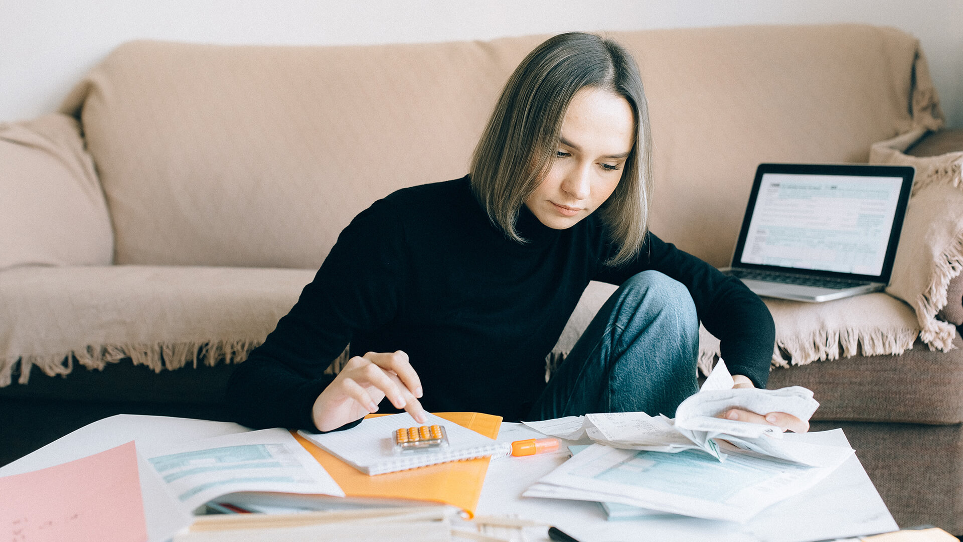 A woman keeps track of business expenses