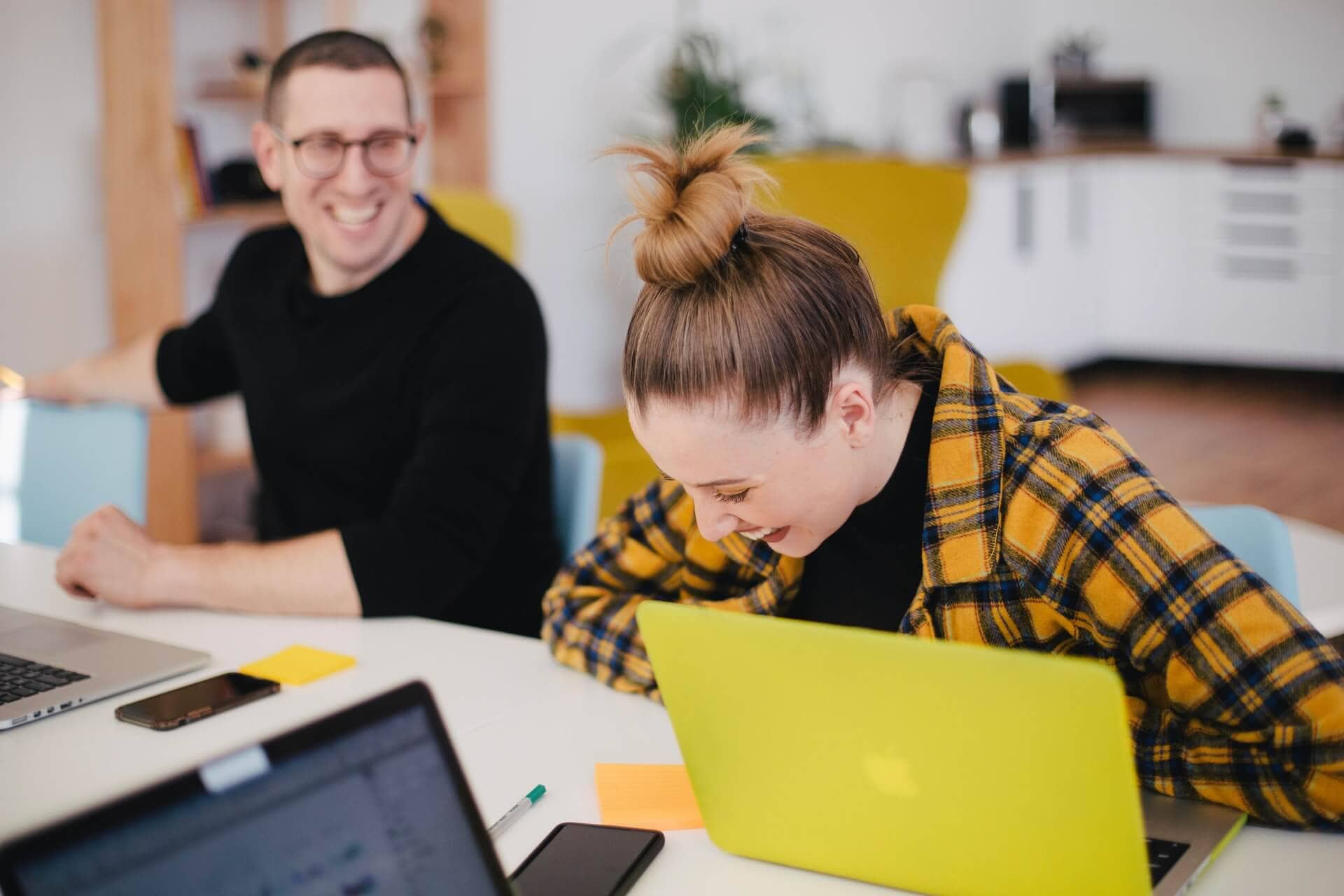 Woman and man laughing in the office