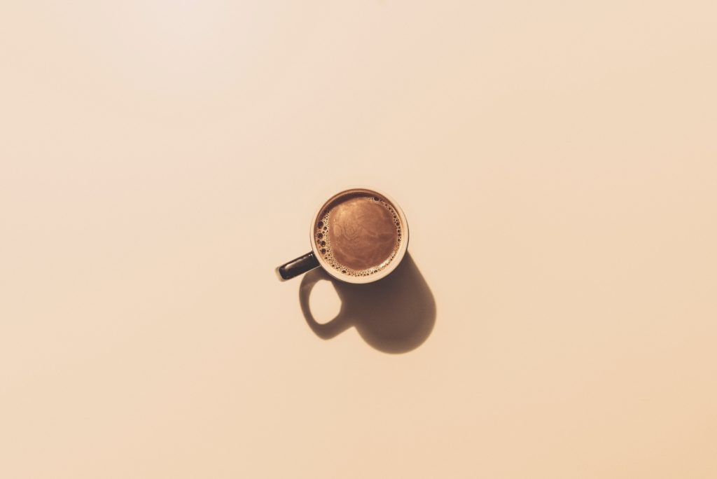 mug filled with copy on beige background