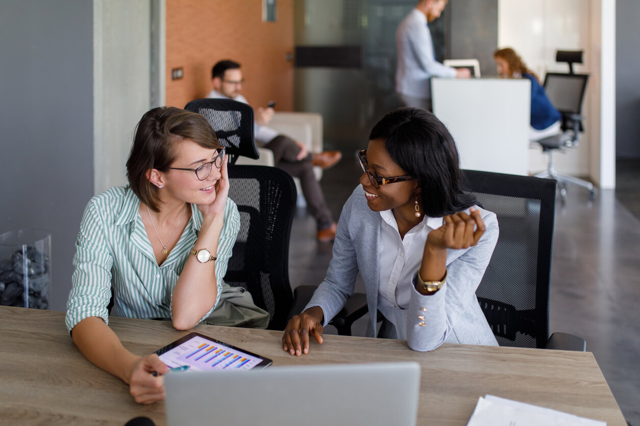 Team members looking over an employee weekly activity report